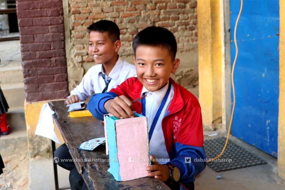 atm machine showing a boy in science exhibition